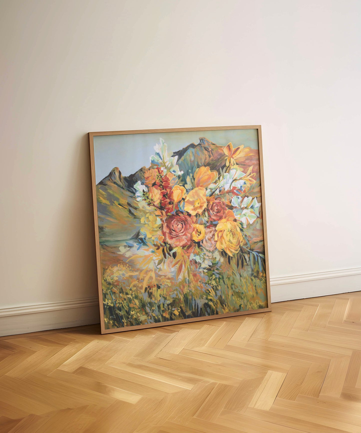 Framed painting of a floral bouquet on a wooden floor against a white wall