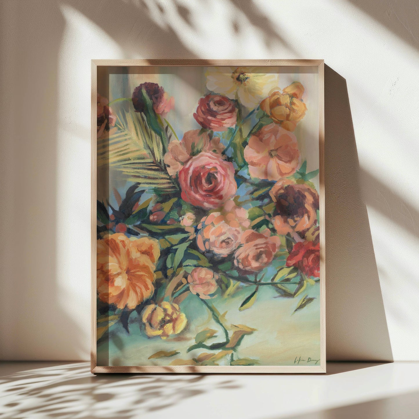 Framed still life floral painting on a white surface with soft shadows