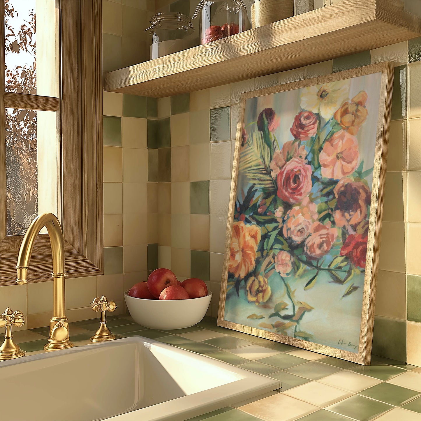 Kitchen counter with a sink, gold faucet, bowl of apples, and colorful floral painting on a tiled wall.