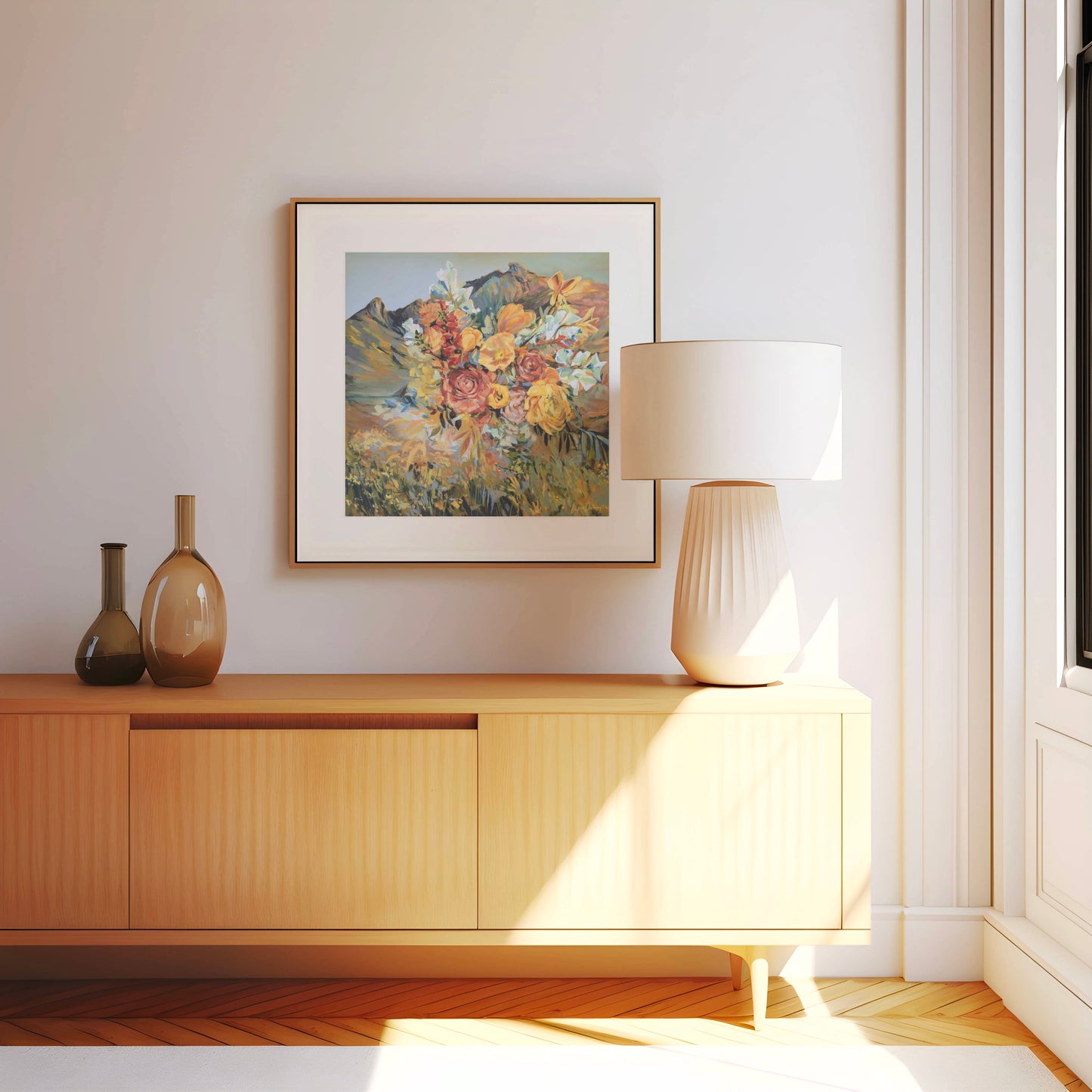 Modern interior with wooden cabinet, lamp, and framed floral artwork on a white wall.