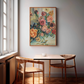 Dining area with a table and chairs, and a colorful still life floral painting on the wall.