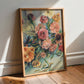Framed floral botanical painting leaning against a white wall on a wooden floor.