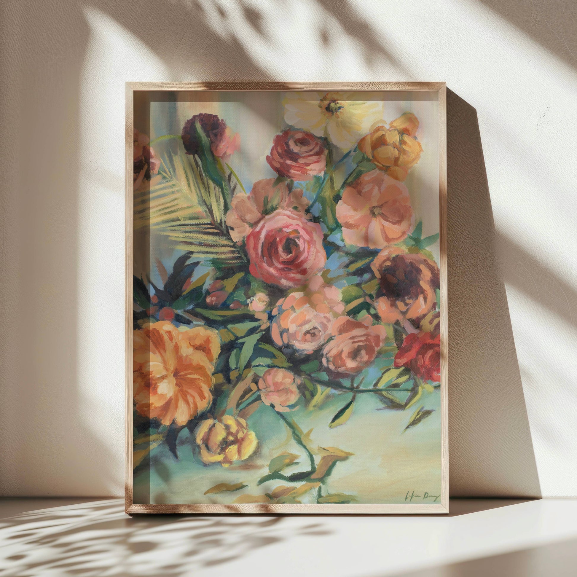 Framed still life floral painting on a white surface with soft shadows